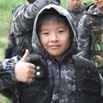 anak-kecil-bermain-paintball-di-batu